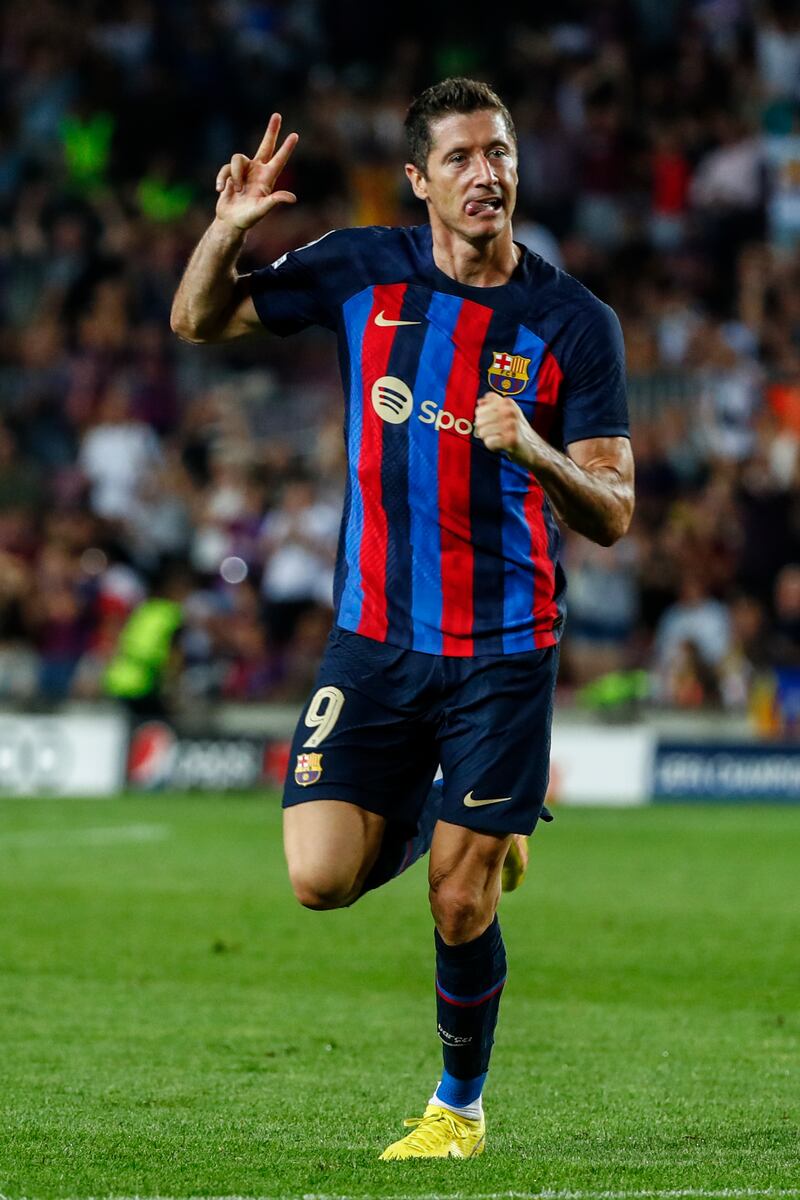 Robert Lewandowski celebrates his hat-trick to put Barca 4-1 ahead. AP