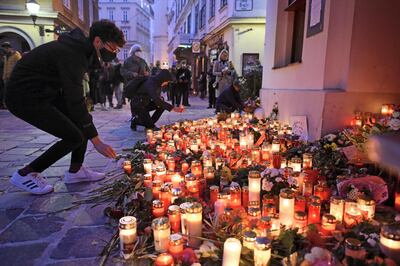VIENNA, AUSTRIA - NOVEMBER 05: People light candles at a makeshift memorial at the scene of a terror attack last Monday in which a gunman shot a number of people, on November 05, 2020 in Vienna, Austria. Kujtim Fejzulai, a 20-year-old with Austrian and North Macedonian citizenship who had been radicalized by Islamic extremism, killed four people and injured 23 others before being shot dead by police. (Photo by Thomas Kronsteiner/Getty Images)