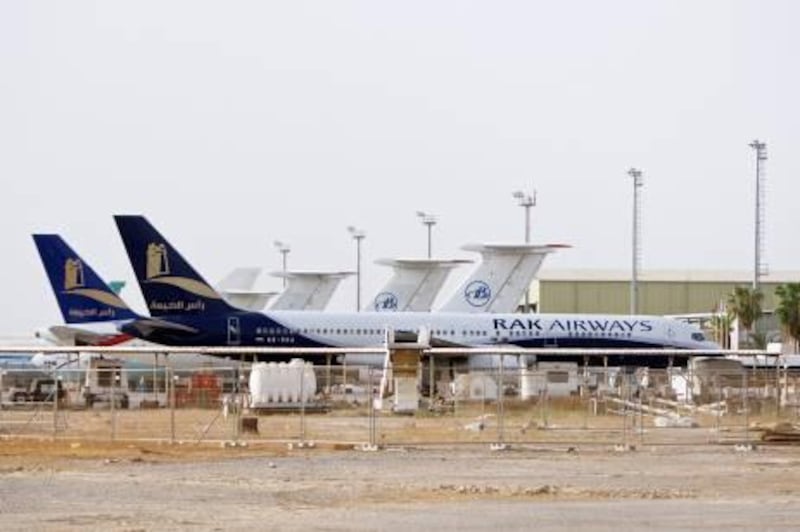 Ras al-Khaimah - August 7, 2008: RAK Airways planes parked on the tarmac of the Ras Al Khaimah International Airport. ( Philip Cheung / The National ) *** Local Caption ***  PC0006-RAKairways.jpgPC0006-RAKairways.jpgBZ04JA P02 RAK AIRWAYS 01.jpg