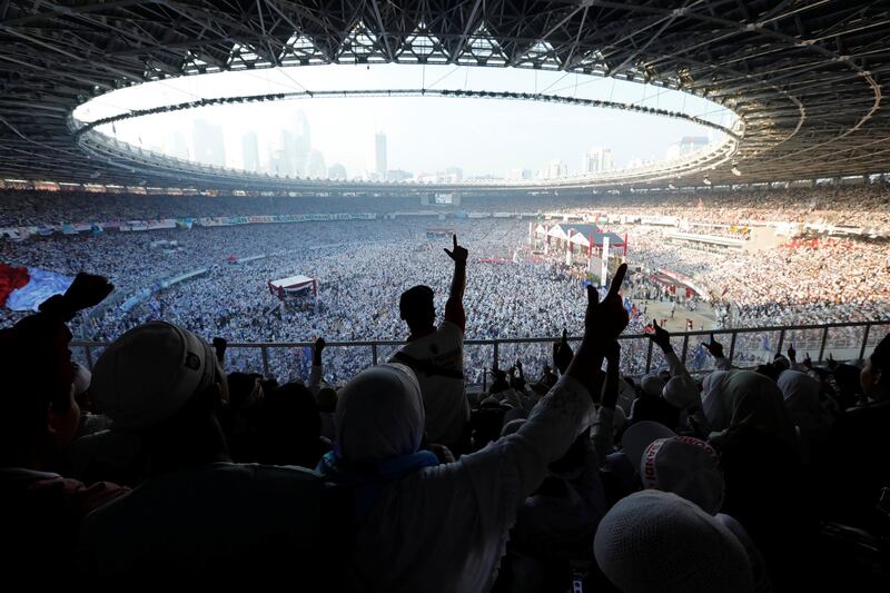 People gesture as they attend a campaign rally of Indonesia's presidential candidate Prabowo Subianto at Gelora Bung Karno Main Stadium in Jakarta, Indonesia. Reuters