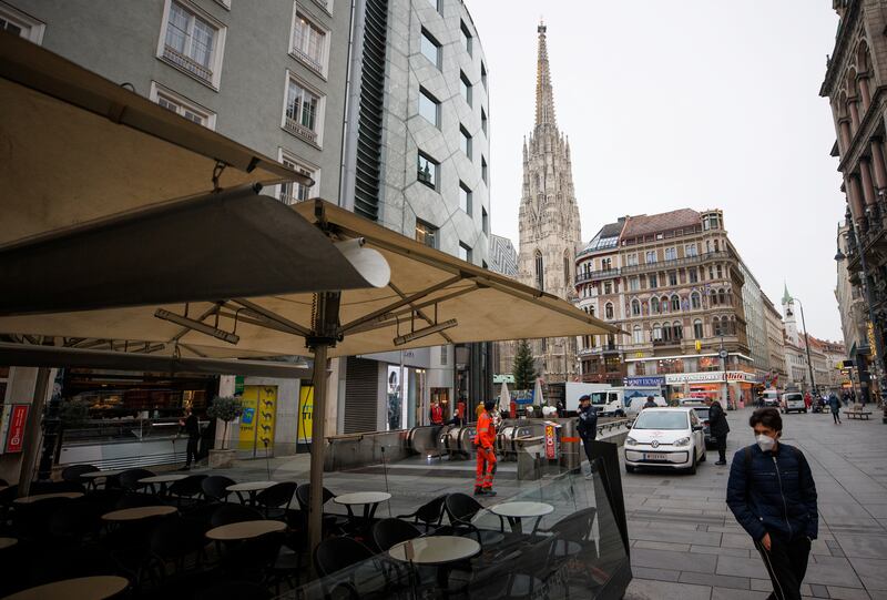 Empty tables at a closed restaurant near St Stephen's Cathedral, a major tourist attraction in Vienna. Reuters