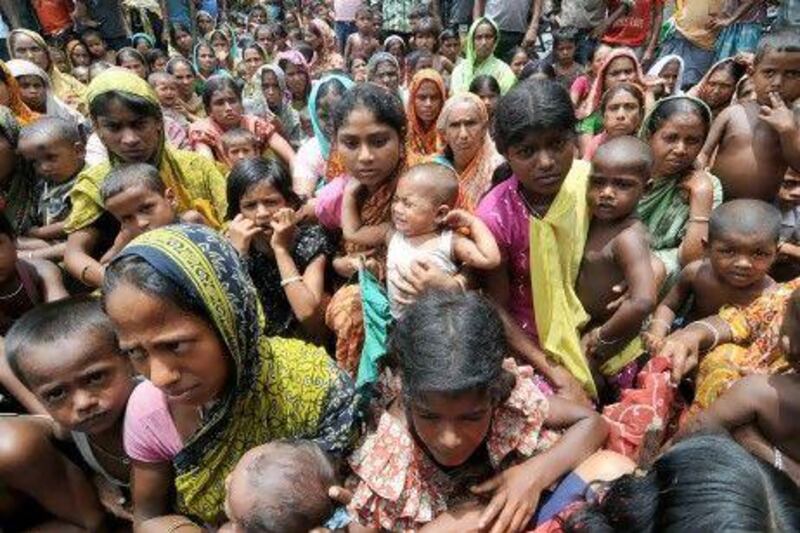 Displaced villagers wait at a relief camp at Bijni village in the Chirang district, some 240km from Guwahati, in India’s northeastern state of Assam. The camp is among nearly 60 hastily set up to cope with an estimated 200,000 refugees.