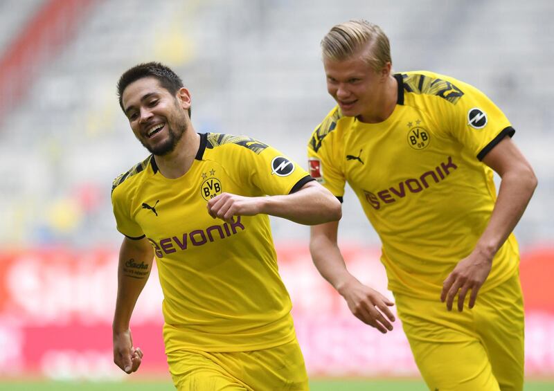 Dortmund's Raphael Guerreiro, left, and Erling Haaland during the Bundesliga match against Fortuna Duesseldorf on Saturday. AP