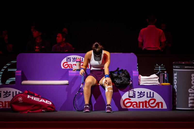 Bianca Andreescu after being forced to retire due to a knee injury from her WTA Finals match  against Karolina Pliskova in Shenzhen, China,  on Wednesday October 30. EPA