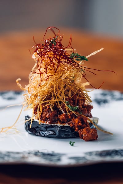 The aubergine comes with ragu of lamb, dates and bzar. Photo: Gerbou / Atelier Hospitality