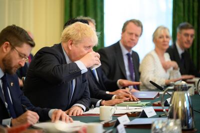 Boris Johnson, pictured chairing a Cabinet meeting in Downing Street on Tuesday, has been warned not to harden his position on the Northern Ireland Protocol in a bid to appeal to members of his divided Conservative Party. Getty Images