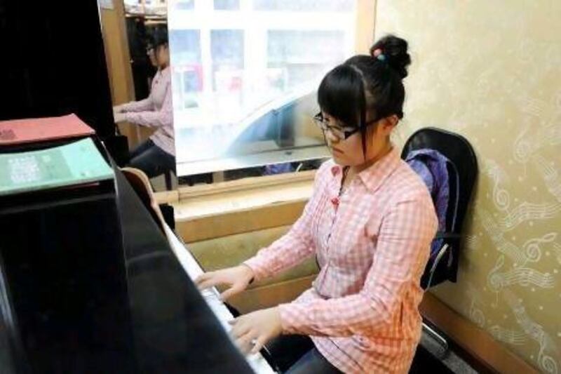 Chu Ziyu, 18, practices piano for more than eight hours a day.