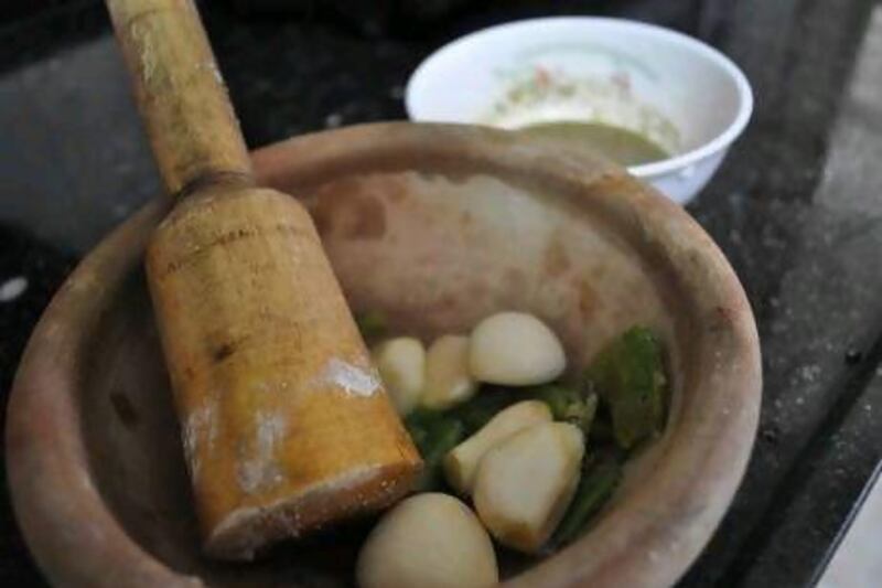 Handmade clay bowls, or zibdiyat, and accompanying lemon wood pestles are staples in the Gaza kitchen, used for everything from pounding garlic and chillies, to baking shrimp stews.