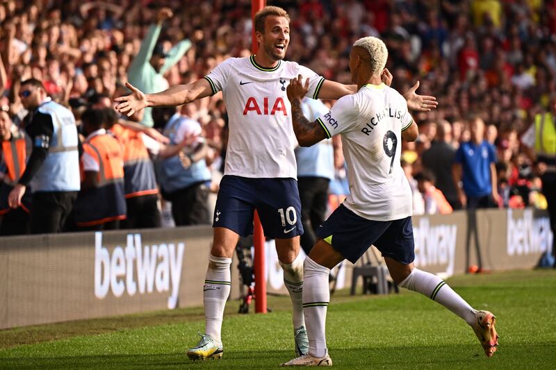 Tottenham Hotspur striker Harry Kane celebrates with Richarlison after scoring his second goal in a 2-0 win over Nottingham Forest at The City Ground in Nottingham, central England, on August 28, 2022. AFP