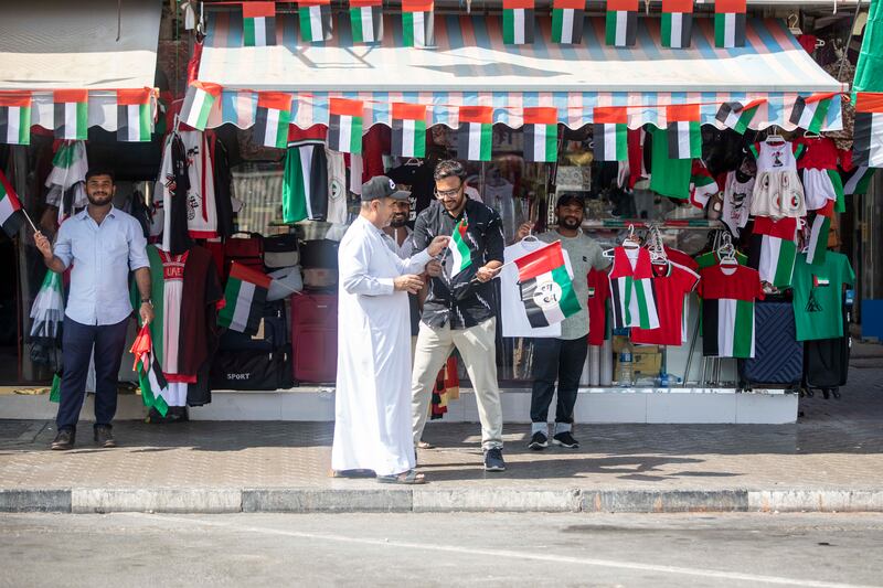 Vendors selling flags and other related items in Satwa, Dubai to celebrate flag day. Ruel Pableo / The National