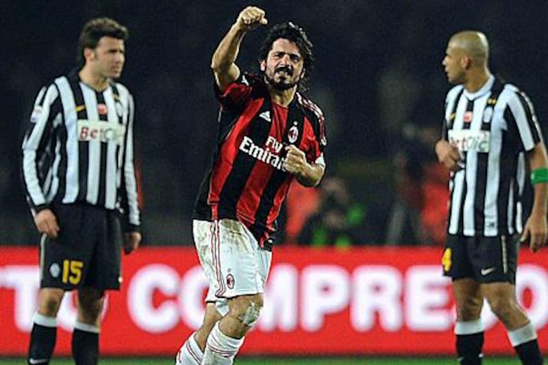 AC Milan's Gennaro Gattuso, centre, celebrates after scoring his first goal in three years to earn his side three points at Juventus.