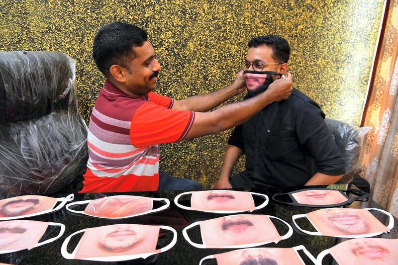 Binesh G Paul from Etumanoor in southern state of Kerala, is using digital printing to customise protective masks for customers by printing their faces on the protective cloth to make it look like real. Photo credit: Binesh G Paul