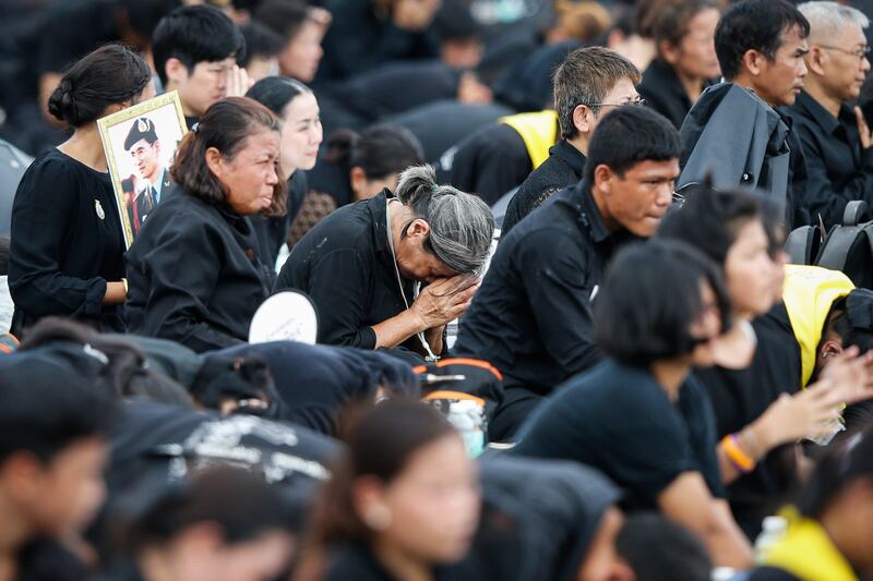 Thai mourners pay their respects during the royal cremation ceremony for the late King Bhumibol Adulyadej. King Bhumibol died at the age of 88 in Siriraj hospital on 13 October, after 70 years on the throne. Rungroj Yongrit / EPA.