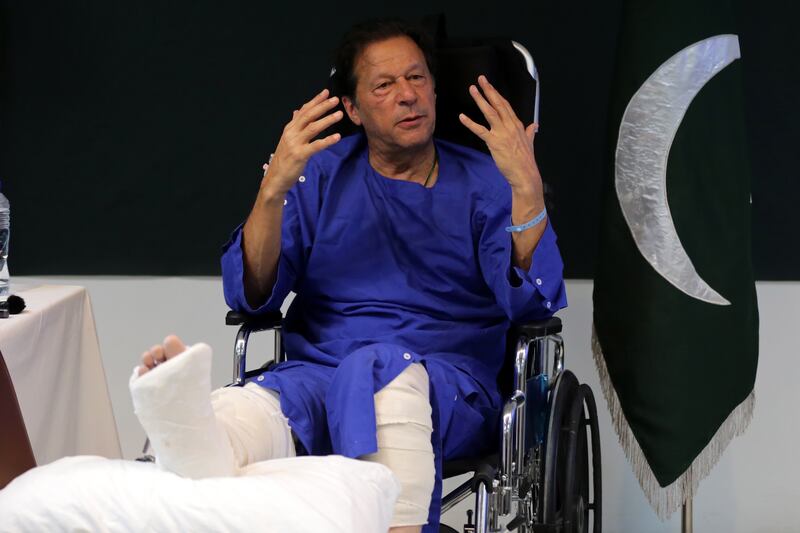 Imran Khan, former prime minister and head of the Pakistan Tehrik-e-Insaf party, speaks to journalists at Shaukat Khanum hospital where he was admitted after being shot, near Wazirabad, in Lahore. EPA