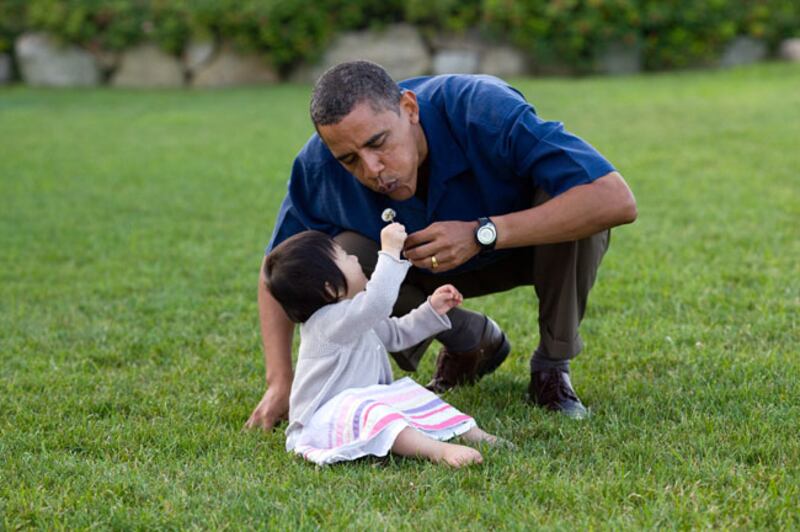 On vacation in Martha’s Vineyard, Mr Obama shared a moment with his young niece, Savita. Photo courtesy of the National Archives