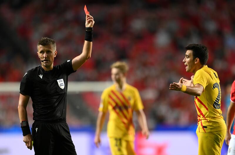 Referee Daniele Orsato shows Barca's Eric Garcia a red card. Getty