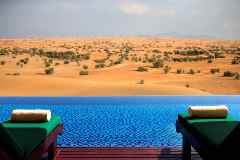 A private pool overlooking the dunes at Al  Maha Desert Resort