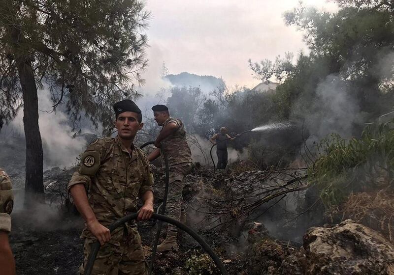 Lebanese army personnel tackle the forest fire. Image @LebarmyOfficial via Twitter