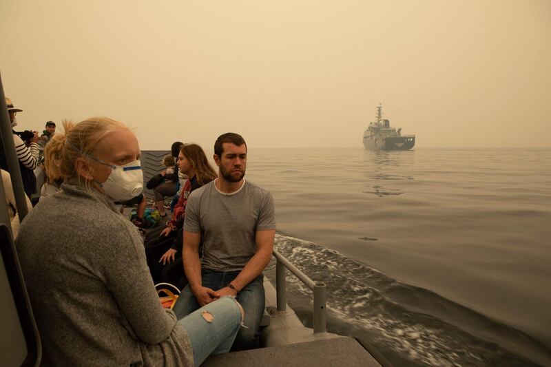 People are being evacuated from Mallacoota, Victoria state, on a landing craft to MV Sycamore, during bushfire relief efforts. AFP