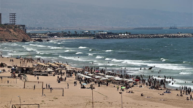 People enjoy the beach during a sunny day in Beirut, Lebanon.  EPA