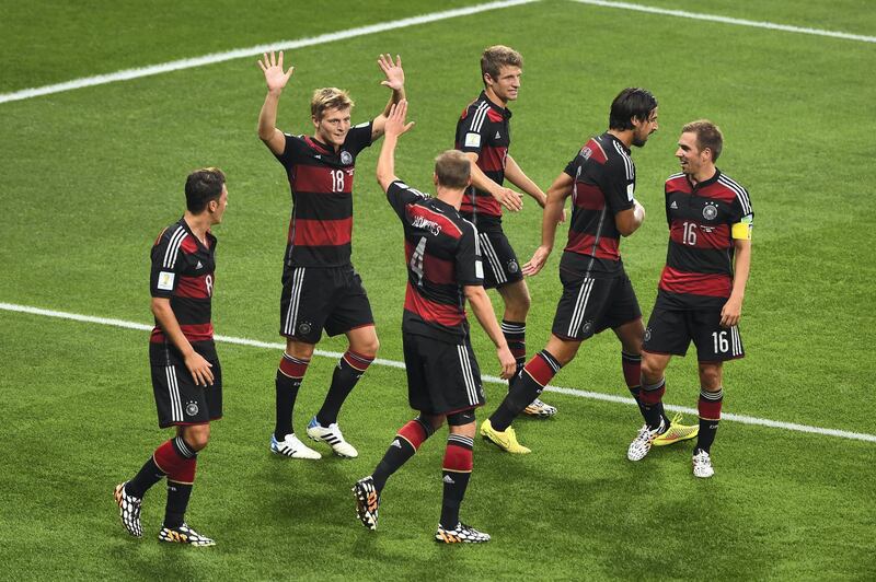 BELO HORIZONTE, BRAZIL - JULY 08:  Toni Kroos (2nd R) of Germany celebrates with his team-mates after scoring their fourth goal during the 2014 FIFA World Cup Brazil Semi Final match between Brazil and Germany at Estadio Mineirao on July 8, 2014 in Belo Horizonte, Brazil.  (Photo by Jamie McDonald/Getty Images)