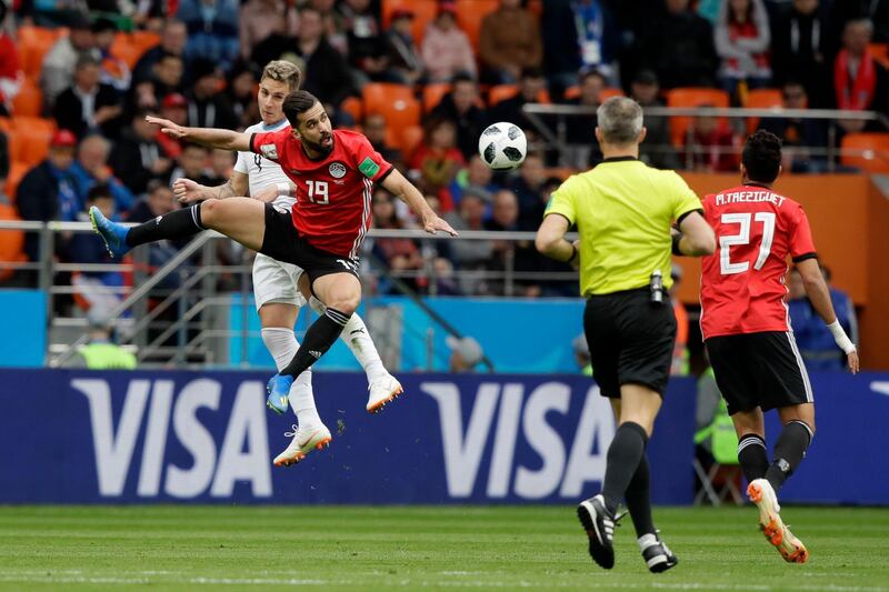 Uruguay's Luis Suarez, background, and Egypt's Abdalla Said challenge for the ball during their group A match at the 2018 FIFA World Cup at the Yekaterinburg Arena in Yekaterinburg, Russia, on June 15, 2018. Mark Baker / AP Photo
