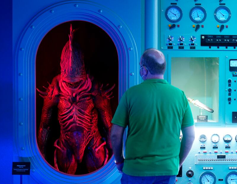A visitor looks at the Trench creature costume featured in the 2018 film 'Aquaman' in the Action and Magic Made Here area at the Warner Bros Studio Tour Hollywood media preview.