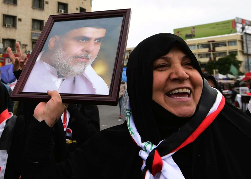 Supporters of Iraqi Shiite cleric Muqtada al-Sadr take part in a protest at the Al-Tahrir square in central Baghdad.  EPA