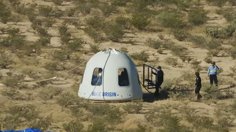 Recovery crews reach the New Shepard NS-18 mission capsule after landing on October 13.  'Star Trek' actor Shatner went where no nonagenarian has been before. AFP