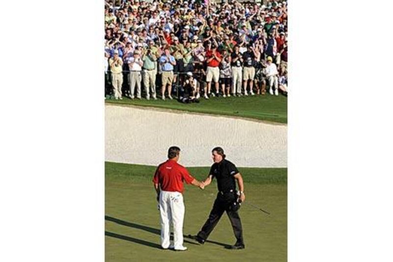 Phil Mickelson, right, shakes hands with Lee Westwood after Mickelson's victory.