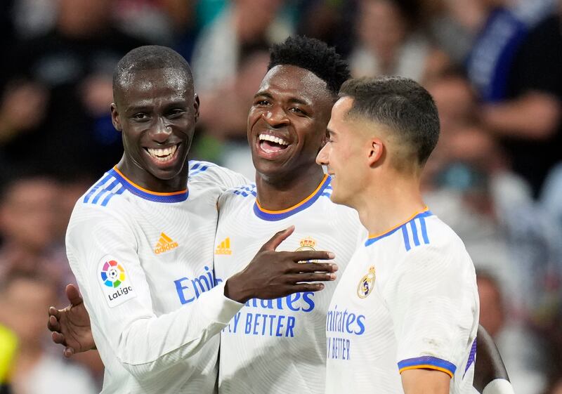 Real Madrid's Vinicius Junior, center, celebrates with teammates after scoring his side's fifth goal. AP