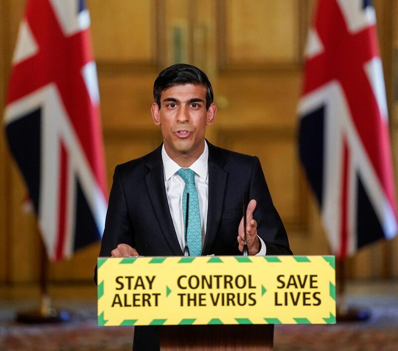 Britain's Chancellor Rishi Sunak chairs the daily COVID-19 briefing at 10 Downing Street with NHS Medical Director for England Professor Stephen Powis (not pictured) in London, Britain May 29, 2020. Andrew Parsons/10 Downing Street/Handout via REUTERS  THIS IMAGE HAS BEEN SUPPLIED BY A THIRD PARTY. IMAGE CAN NOT BE USED FOR ADVERTISING OR COMMERCIAL USE. THE IMAGE CAN NOT BE ALTERED IN ANY FORM. NO RESALES. NO ARCHIVES