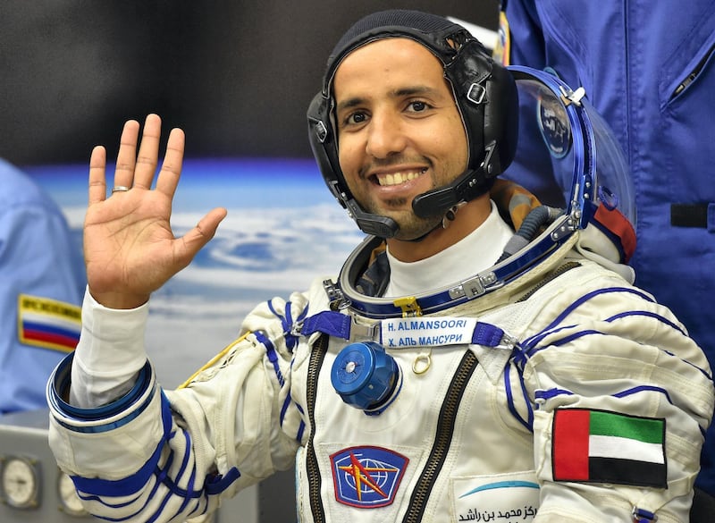 United Arab Emirates' astronaut Hazzaa al-Mansoori  waves before boarding a Soyuz rocket to the International Space Station (ISS) at the Russian-leased Baikonur cosmodrome in Kazakhstan on September 25, 2019. (Photo by VYACHESLAV OSELEDKO / AFP)