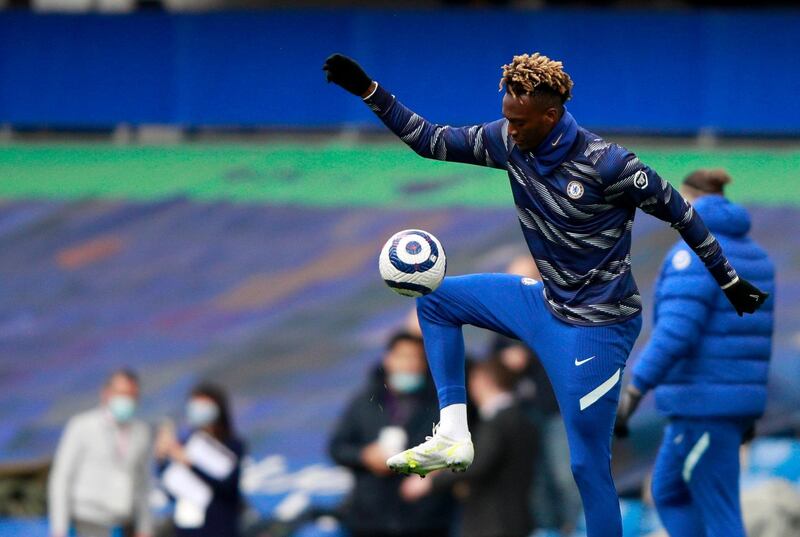 Chelsea's Tammy Abraham controls the ball during warm up before the English Premier League soccer match between Chelsea and Fulham at Stamford Bridge Stadium in London, Saturday, May 1, 2021. (AP Photo/Ian Walton, Pool)