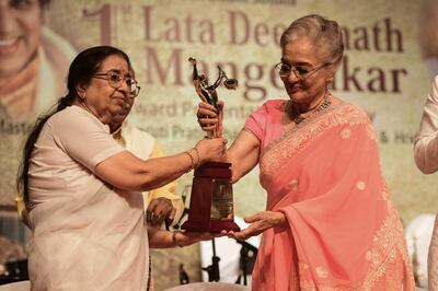 Asha Parekh, right, receives the Lata Deenanath Mangeshkar award, named after the late Bollywood singer, from Mangeshkar's sister, singer Asha Bhosle, in April. AFP 