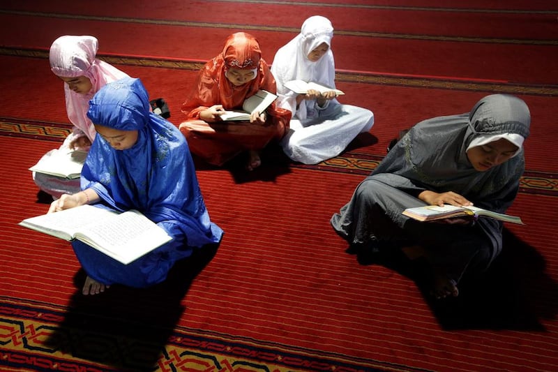 Indonesian women read the Quran at Istiqlal Mosque in Jakarta on June 9, 2016. Bagus Indahono / EPA