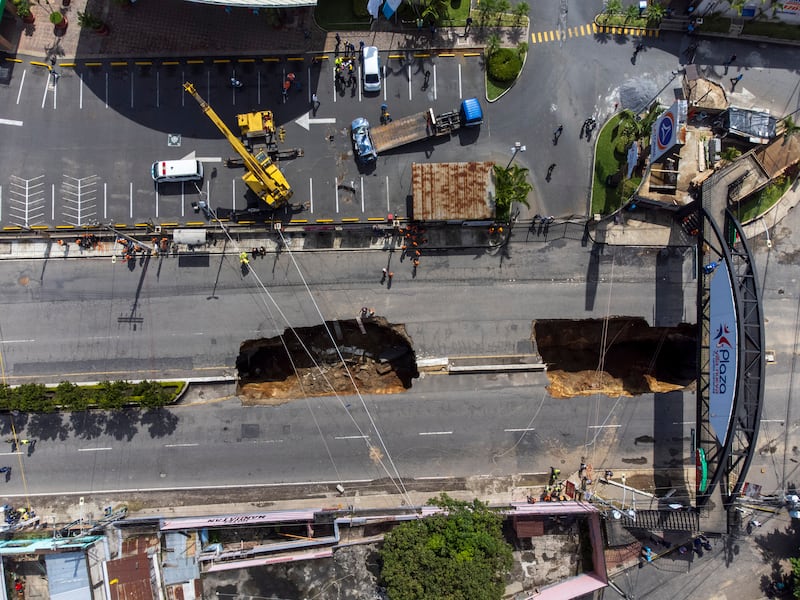 The sinkholes formed on a street in the municipality of Villa Nueva, 20 kilometres south of Guatemala City. AP Photo

