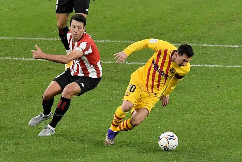 Messi dribbles past Athletic Bilbao's Mikel Vesga. AP