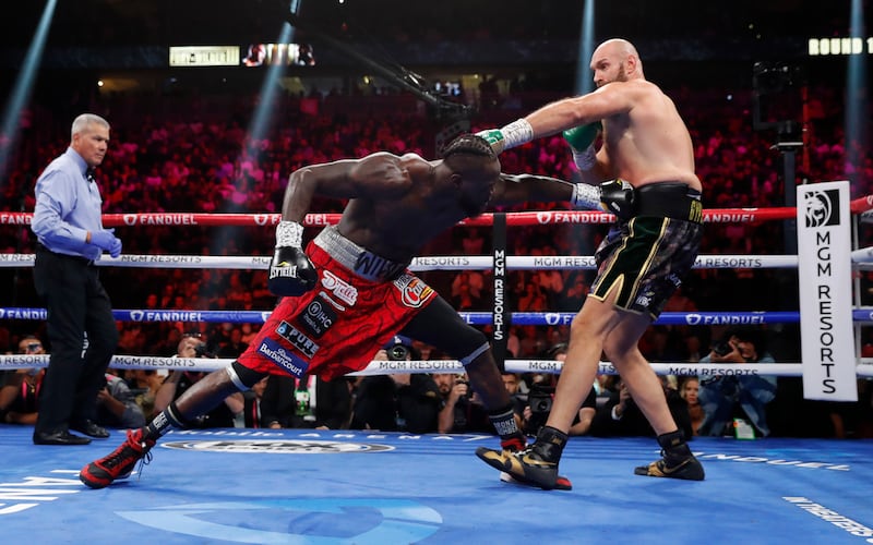 Fury in action against Deontay Wilder in round one. Reuters