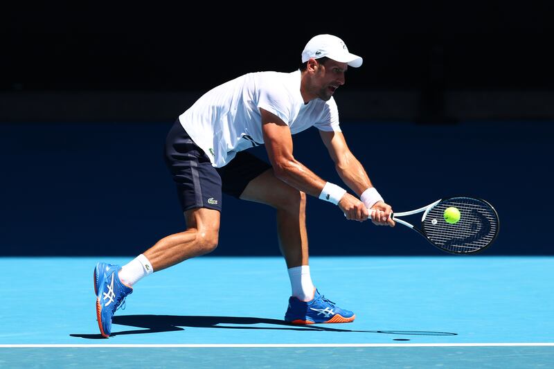 Novak Djokovic plays a backhand during a practice match against Daniil Medvedev. Getty