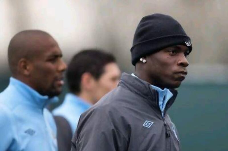 Manchester City's Mario Balotelli trains with teammates at Carrington ahead of the Champions League match with Real Madrid