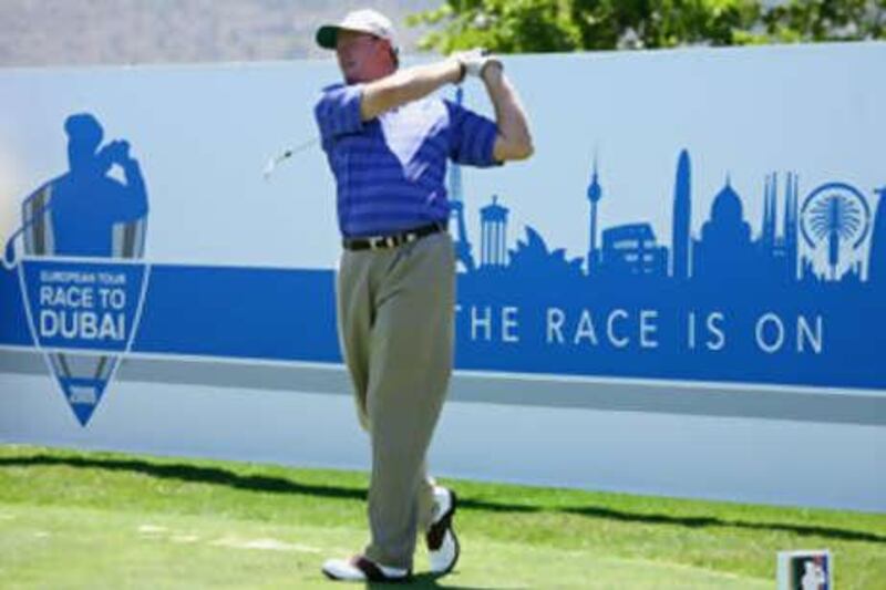 Ernie Els of South Africa tees off during the pro-am of the South African Open Championship.