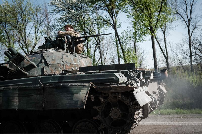 A Ukrainian soldier sits on a tank near Slovyansk, eastern Ukraine, where Russia have been building up forces. AFP