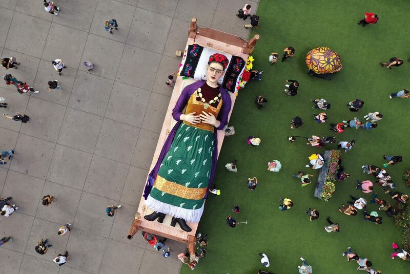 Artist and painter Frida Kahlo is pictured lying in bed on the inauguration day of the exhibition Los Colores de Frida (The Colours of Frida) in her honour, at Zocalo square in Mexico City. AFP