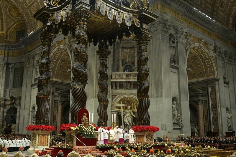 Pope Francis celebrates a mass on Christmas Eve at St Peter's basilica in the Vatican.  AFP