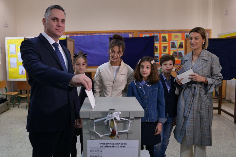 REFILE - CORRECTING BYLINE Cyprus presidential candidate Nikolas Papadopoulos leader of the center-right DIKO party, accompanied by his family, casts his ballot for a presidential election at a polling station in Nicosia, Cyprus January 28, 2018. REUTERS/Stefanos Kouratzis