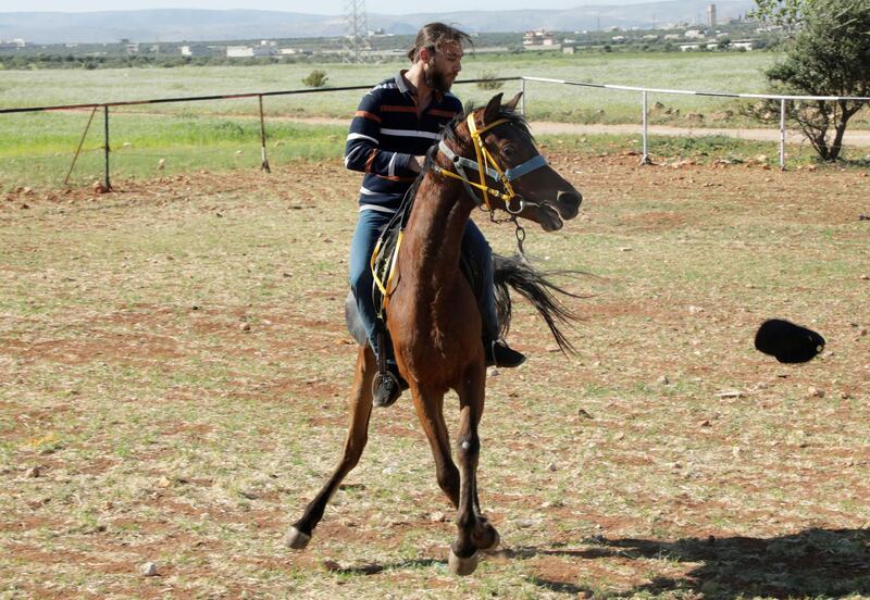 Hussein Rahmoun and his horse, Amira, fled his hometown because of the conflict in Syria. Amira stays at the farm. Reuters
