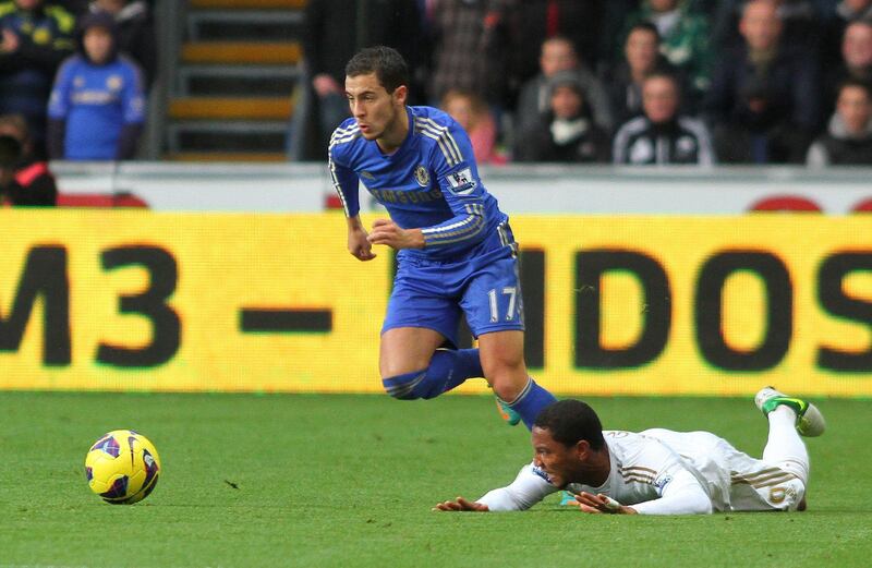 epa03456688 Wayne Routledge (R) of Swansea and Eden Hazard (R) of Chelsea battle for the ball during the English Premier League football match played between Swansea City FC and Chelsea FC at Swansea`s Liberty Stadium, Swansea, South Wales, Great Britain, Saturday 03 November 2012.  EPA/GEOFF CADDICK DataCo terms and conditions apply. http//www.epa.eu/downloads/DataCo-TCs.pdf *** Local Caption ***  03456688.jpg