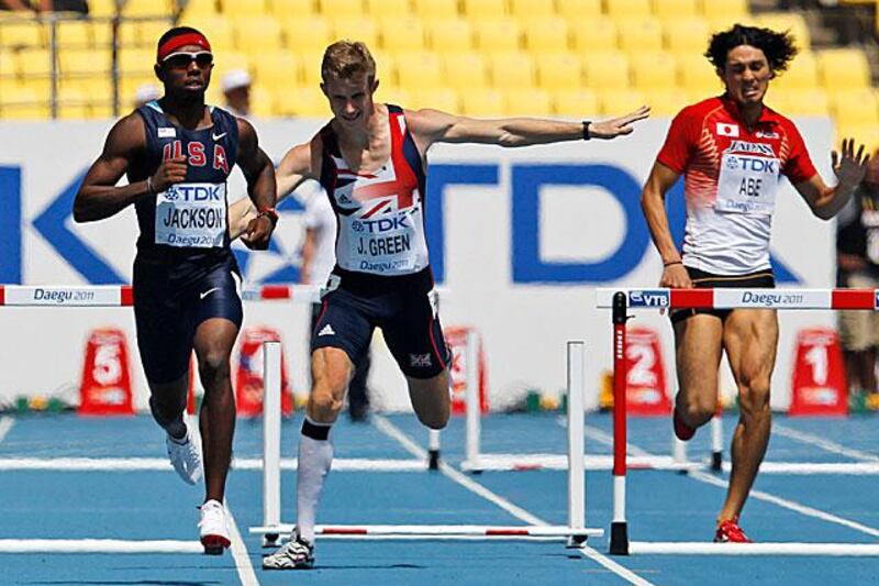 Jack Green of Britain, centre, stumbles over a hurdle during his heat of the 400m hurdles.

Anja Niedringhaus / AP Photo