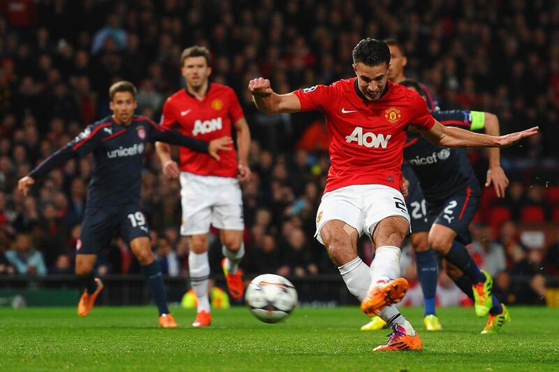 MANCHESTER, ENGLAND - MARCH 19:  Robin van Persie of Manchester United scores the opening goal from a penalty kick during the UEFA Champions League Round of 16 second round match between Manchester United and Olympiacos FC at Old Trafford on March 19, 2014 in Manchester, England.  (Photo by Laurence Griffiths/Getty Images)